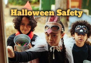 Halloween Safety. Three kids in costumes, one is holding up a bucket of candy.